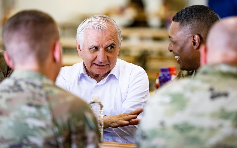 Sen. Jack Reed, D-R.I., chairman of the Armed Services Committee, speaks to Army Col. Rick Turner, division plans and operations officer for 101st Airborne Division, and other soldiers assigned to 101st Airborne Division during a visit at Mihail Kogalniceanu Air Base, Romania, on June 30, 2022. 