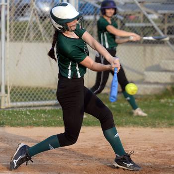 Kubasaki freshman Landry Murray belts one of her four hits against Kadena during Thursday's DODEA-Okinawa softball game. The Dragons rallied for eight runs in the bottom of the seventh to edge the Panthers 21-20.