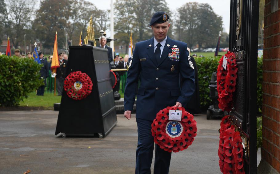 U.S. Air Force Chief Master Sgt. Jesse Frank lays a wreath Nov. 12, 2023, during a Remembrance Day ceremony in Stowmarket, England. A contingent of 17 American airmen from RAF Lakenheath marched in the Remembrance Day parade. 