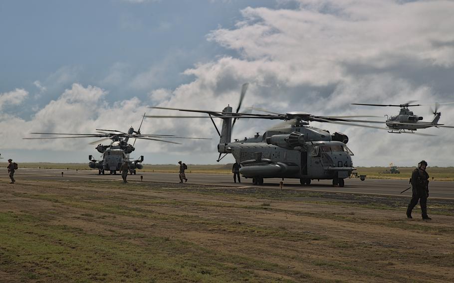 U.S. Marine Corps AH-1Z Viper helicopters assigned to Marine Light Attack Helicopter Squadron (HMLA) 367 and CH-53E Super Stallion helicopters assigned to Marine Heavy Helicopter Squadron (HMH) 463 take off and land at Pacific Missile Range Facility Barking Sands, Hawaii, Nov. 2, 2021. The U.S. military said Tuesday it’s responding to “an aviation incident” on the island of Kauai in Hawaii.