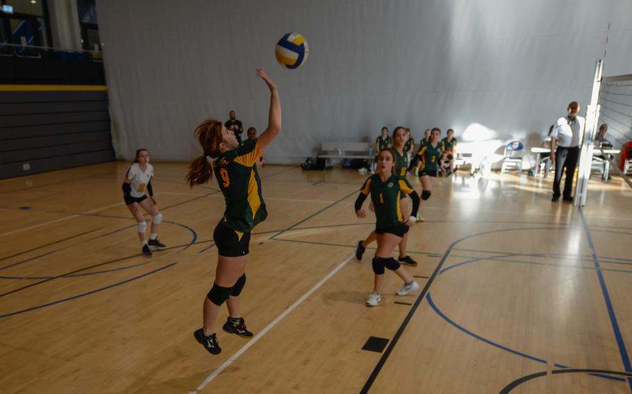 Macy Gilbert of SHAPE  jumps for the ball during the Division I game against Wiesbaden Oct. 27, 2022, at Ramstein Air Base, Germany.