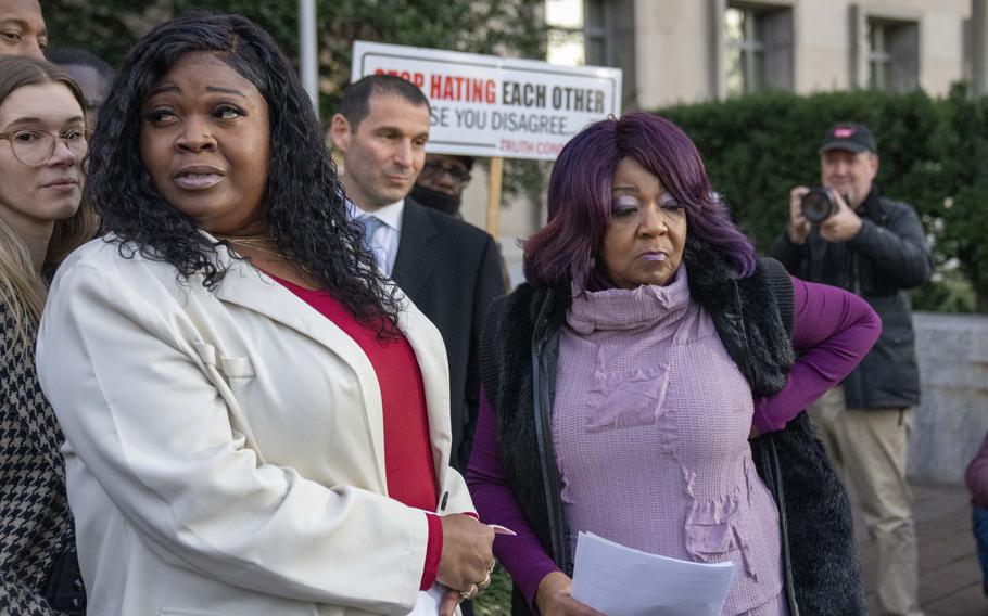 Wandrea “Shaye” Moss, left, and her mother Ruby Freeman, right, leave after speaking with reporters outside federal court in Washington on Dec. 15.