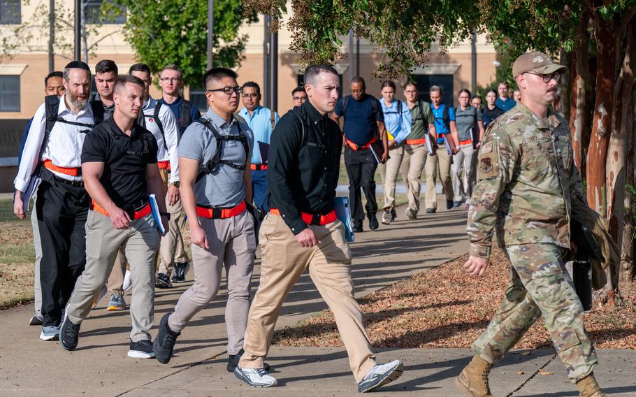 The first class of the Air Force's Officer Training School in-processes at Maxwell Air Force Base, Ala., Oct. 10, 2023. The new OTS program challenges new officers with five learning modules tied to leadership, mission command, warfighting, communication and professionalism.  