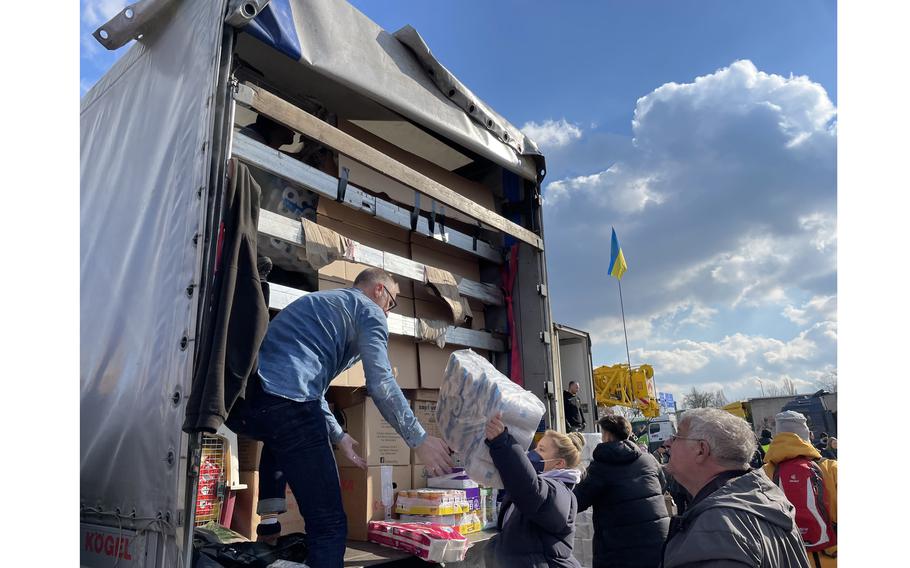 Volunteers in Berlin help fill a truck bound for Ukraine on March 4, 2022. 