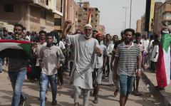 Anti-military protesters march on Friday, July 1, 2022 in Khartoum, Sudan, a day after nine people were killed in demonstrations against the country’s ruling generals.  (AP Photo/Marwan Ali)