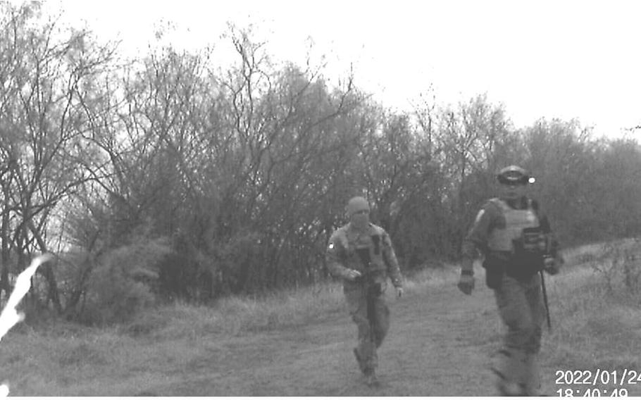 A member of the Texas National Guard and a Border Patrol agent shown by a security camera Jan. 24, 2022, walking through the National Butterfly Center without permission. Center personnel said, at least twice, they have seen troops travel across the center’s private property from other private property to federal land on the other side.