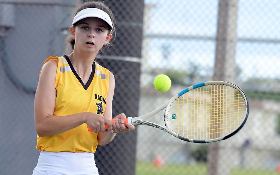 Kadena's Megan Fife hits a backhand return against Kubasaki during Thursday's Okinawa mixed-doubles tennis matches. Fife and partner Iain Stanley lost 8-6 to Kubasaki's Sam Bierman and Lillian Law.