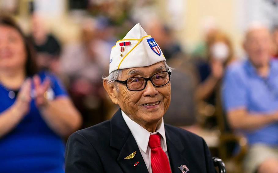 U.S. Army Air Forces veteran Richard Goon, 98, middle, is congratulated after receiving the Congressional Gold Medal during a virtual ceremony at the Grand Villa Senior Living Community on Tuesday, July 5, 2022, in Deerfield Beach, Florida. 