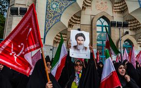 Pro-government protesters chant slogans during a demonstration staged in support of the Islamic Republic's mandatory hijab laws in Tehran on Monday, April 22, 2024. (Hossein Beris/Middle East Images/AFP via Getty Images/TNS)