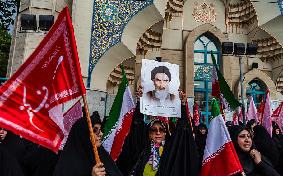 Pro-government protesters chant slogans during a demonstration staged in support of the Islamic Republic’s mandatory hijab laws in Tehran on Monday, April 22, 2024.