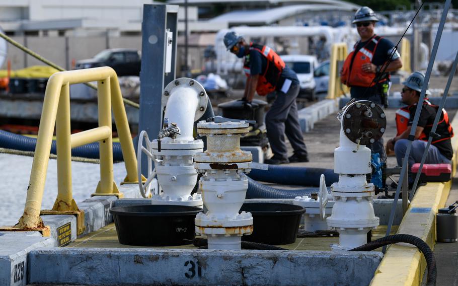 Workers at the Naval Supply Systems Command Fleet Logistics Center at Pearl Harbor in Hawaii begin on Oct. 27, 2022, to remove approximately one million gallons of fuel from three primary fuel pipelines connecting the Red Hill Bulk Fuel Storage Facility to fuel points at Joint Base Pearl Harbor-Hickam. 