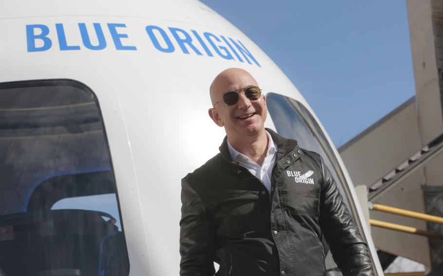 Jeff Bezos, founder of Amazon and Blue Origin, smiles while speaking at the unveiling of the Blue Origin New Shepard system during the Space Symposium in Colorado Springs, Colo., on April 5, 2017.