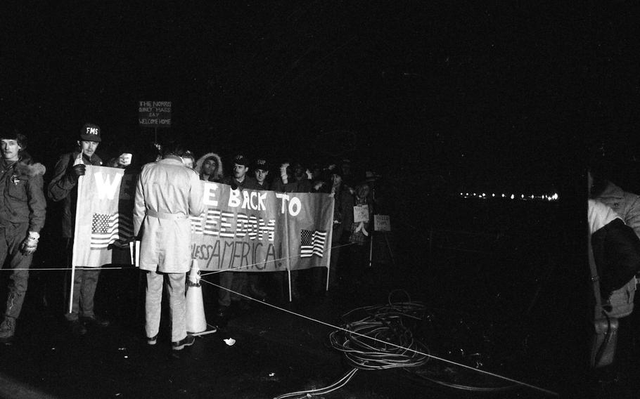 Thousand of well-wishers gathered at Rhein-Main Air Base with signs and banners to welcome the 52 Americans held captive in Iran since Nov. 4, 1979, to freedom.