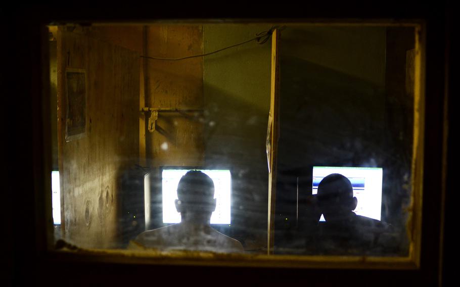 Soldiers with the 1st Battalion, 501st Infantry Regiment use computers in a Morale, Welfare and Recreation room at Combat Outpost Sabari, Khost province.