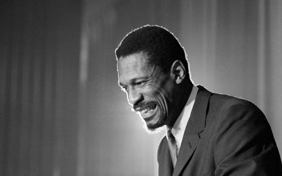 Bill Russell grins at an announcement that he has been named coach of the Boston Celtics basketball team, April 18, 1966.