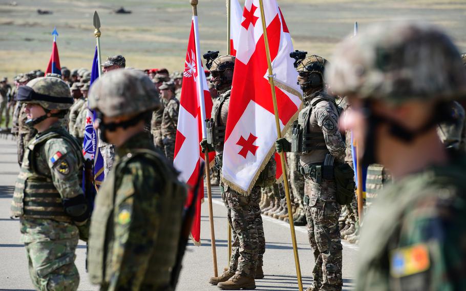 Service members from all participating allied and partner nations, including U.S. soldiers and Marines, stand in formation at the opening ceremony of Exercise Agile Spirit near Tbilisi, Georgia, on Aug. 21, 2023. 