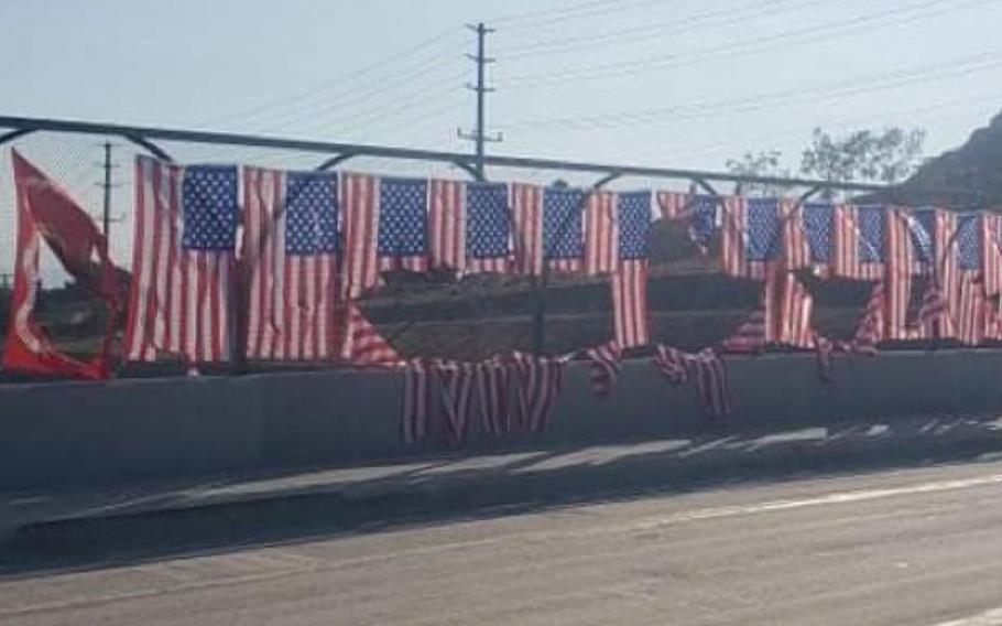 Someone vandalized a display of 13 U.S. flags and a U.S. Marine Corps flag honoring troops slain in the Aug. 26 bomb blast in Afghanistan, California police say.