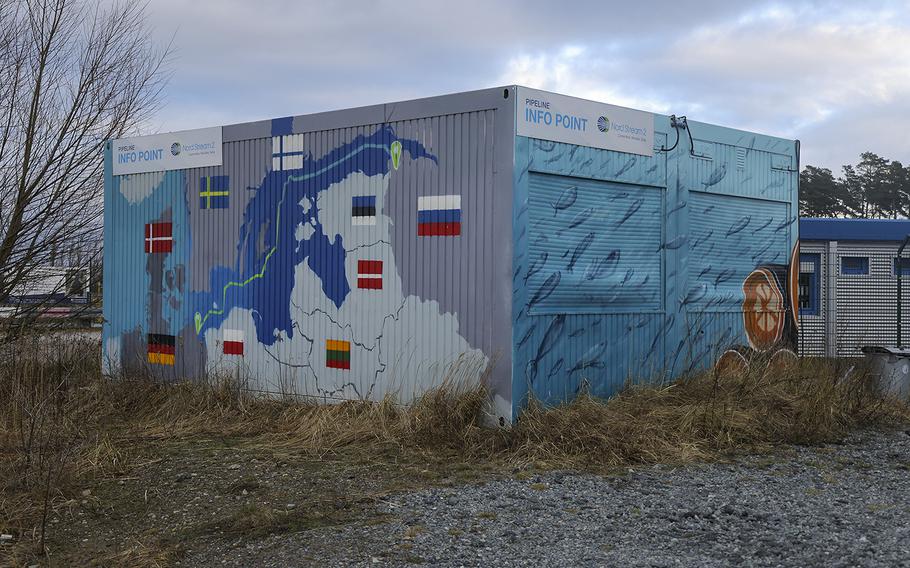 A map shows the course of the Nord Stream 2 gas pipeline from Russia to Germany on the exterior of an informational booth close to the receiving station for Nord Stream 2 on Feb. 2, 2022, near Lubmin, Germany. 