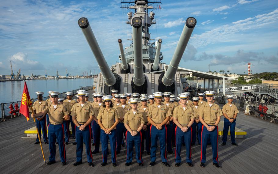 Marines pose in a group on the deck of the USS Missouri.