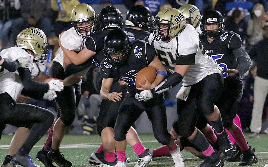 Osan's Eddie Kim is surrounded by a sea of Humphreys Black defenders.