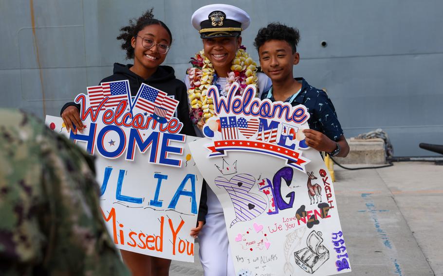 A sailor assigned to the Ticonderoga-class guided missile-cruiser USS Antietam (CG 54) reunites with family after arriving at new homeport Joint Base Pearl Harbor-Hickam, Hawaii, Friday, April 5, 2024. 
