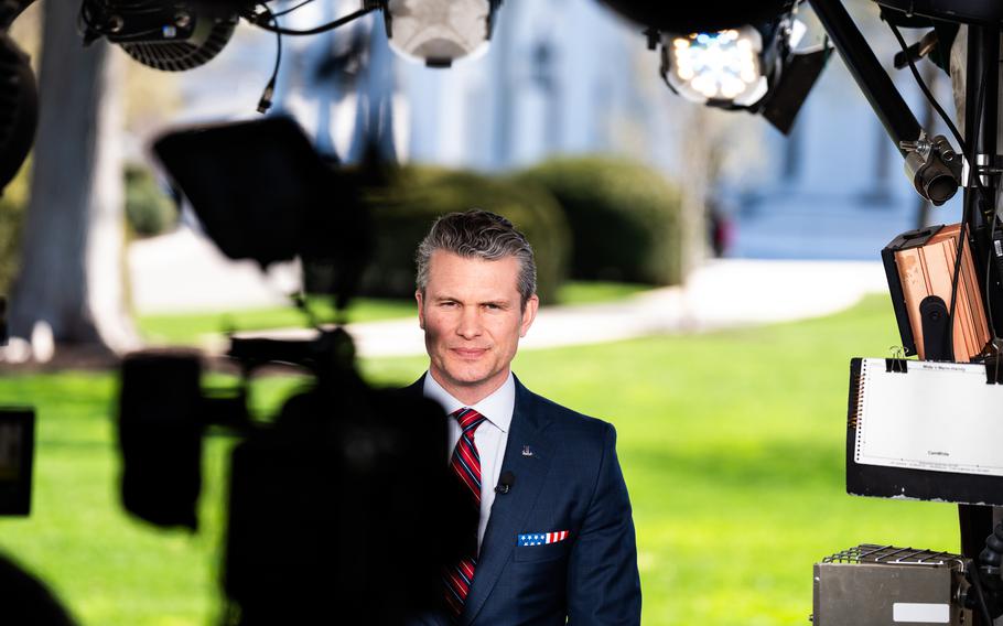 Secretary of Defense Pete Hegseth does a television interview.