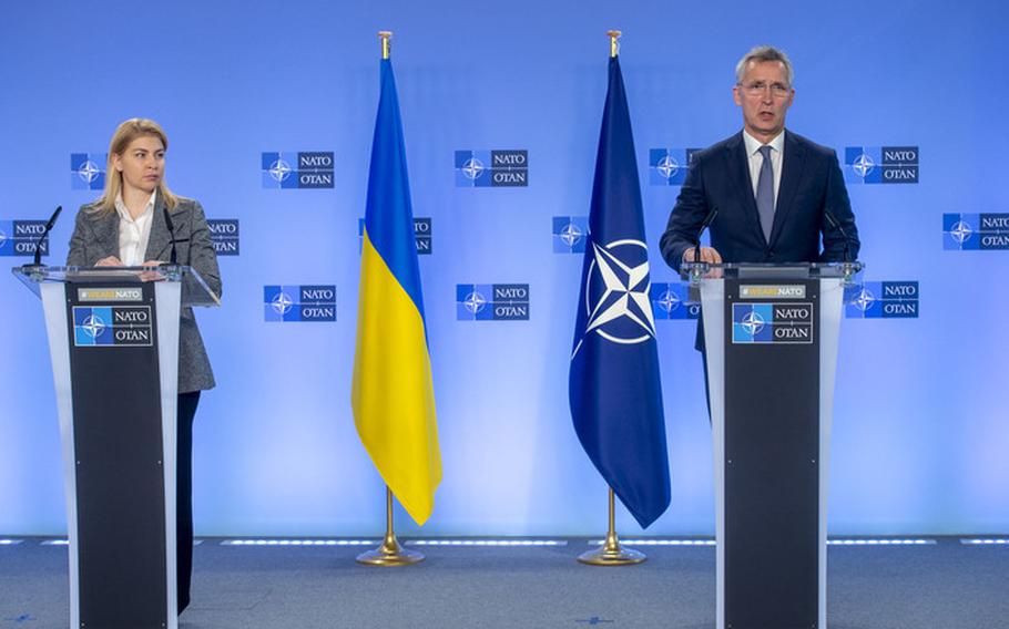 NATO Secretary-General Jens Stoltenberg, right, and Olga Stefanishyna, the deputy prime minister for European and Euro-Atlantic integration of Ukraine, speak to reporters at NATO headquarters in Brussels, Jan. 10, 2022. On Jan. 12, Stoltenberg said the alliance will do what it can to prevent armed conflict in Europe over Ukraine. 