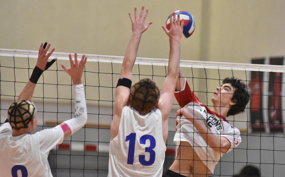 American Overseas School of Rome's Aurelien Berthet tries to get past the ball past the webbed heads of Sigonella's Christopher Hedemand, left, and Levi Wilhelm on Friday, Oct. 28, 2022.

Kent Harris/Stars and Stripes