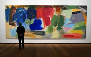 A visitor to Museum Reinhard Ernst looks at “Argonaut,” a 1983 work by Friedel Dzubas. The Wiesbaden, Germany museum displays abstract art that its founder, Reinhard Ernst, collected in the past 30 years.