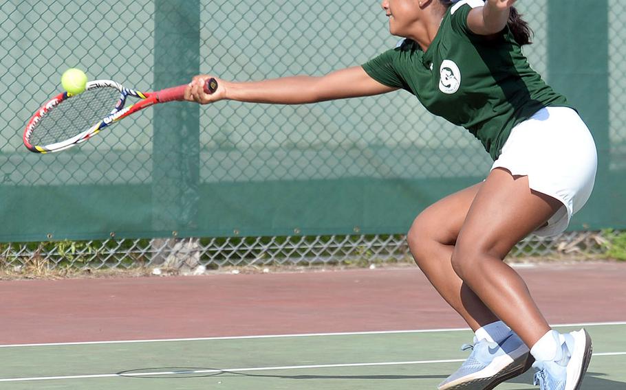 Kubasaki's Nicole Fuentes lunges for a forehand shot against Kadena's Elizabeth Cheramie during Wednesday's Okinawa tennis matches. Fuentes won 8-5.