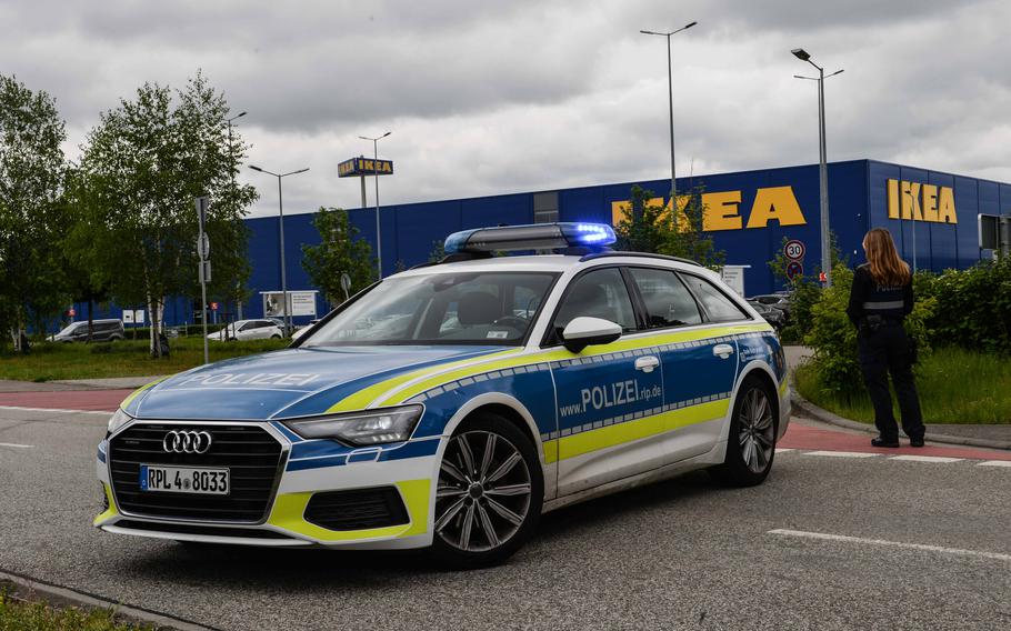 A German police patrol blocks a road near the former Opel factory in Kaiserslautern, Germany, on May 11, 2023. The discovery of a 550-pound World War II bomb caused a handful of street closures.