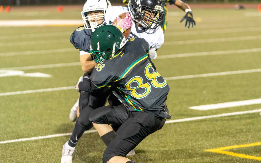 Zama's Ryan Pena gets bottled up by Edgren's Gabriel Guajardo, Aiden Larry and Frederick Stewart.