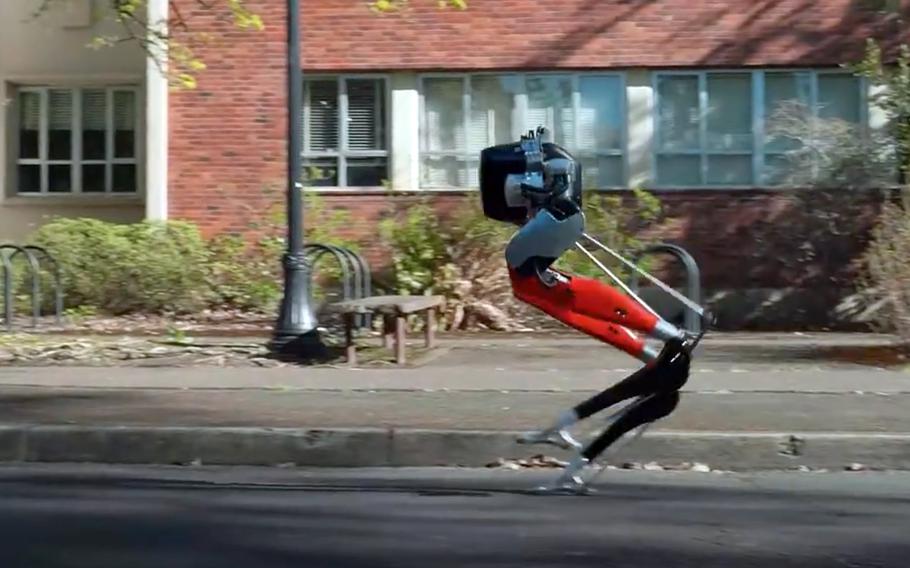 In a screenshot from a video on the Oregon State University YouTube site, Cassie, a bipedal robot developed by the university with funding from Defense Advanced Research Projects Agency, made history by learning how to run and then complete a 5-kilometer outdoor run.