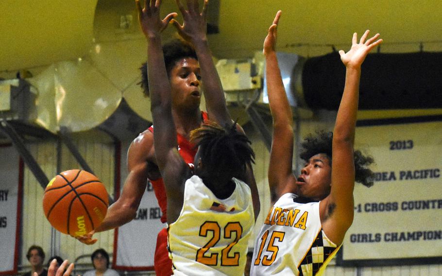 Kinnick's Jaelin White faces up against Kadena's Jayden Allen and Cory Tripp.