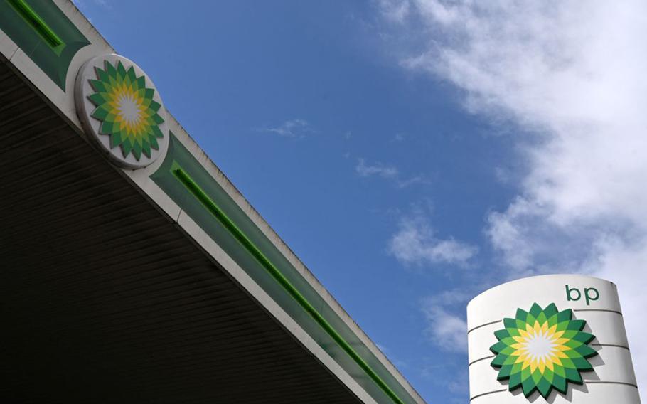 BP logos are pictured at a BP petrol and diesel filling station in north London on May 12, 2021. 