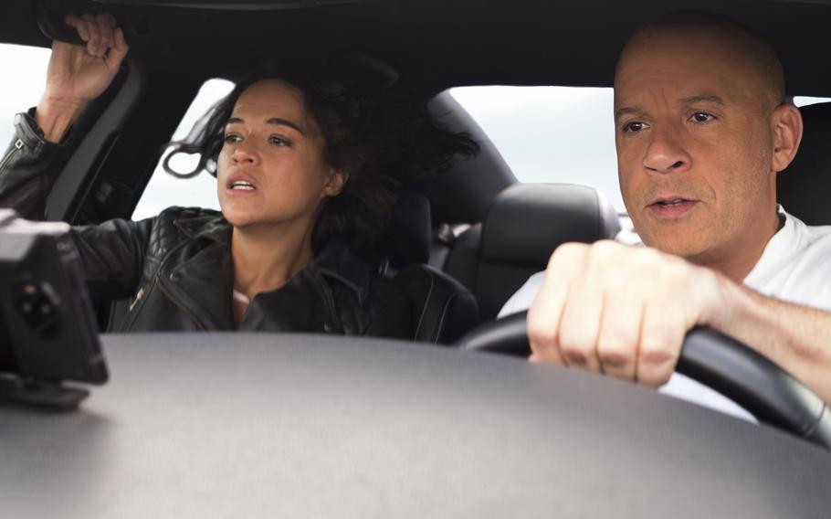 Michelle Rodriguez, left, and Vin Diesel star in the latest “Fast and Furious” movie, “F9.” 