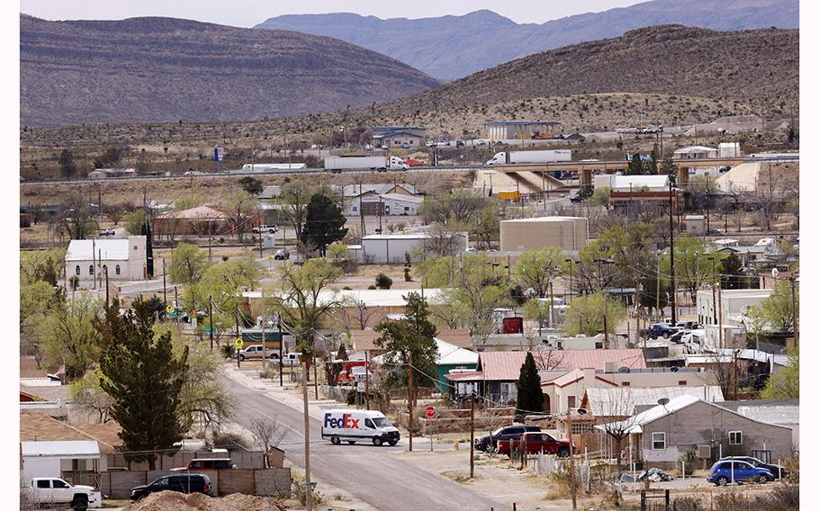 Trucks on Interstate 10 and in town pass through Sierra Blanca, Texas, March 22, 2023.