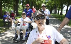 World War II Army veteran Ruth Jones, 97, who served as a surgical technician in the Women’s Army Corps from 1945-1947, leaves the World War II Memorial on the National Mall in Washington, D.C. on Tuesday, May 31, 2022. Jones said when she enlisted in the Army, her name and address had been put in the Stars and Stripes because of a contest she took part in to see who could bring in the most newspapers. "Because you salvage them in the war, and I happened to fill the quota of that particular month, and so they put my picture in the Stars and Stripes, and an RAF guy in England  saw it and he started writing to me.” 