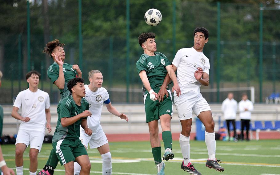 SHAPE forward Santiago Torrente de la Pisa and Ramstein defender Caio Anderson go up to head a ball during the Division I final of the DODEA European championships on May 23, 2024, at Ramstein High School on Ramstein Air Base, Germany.