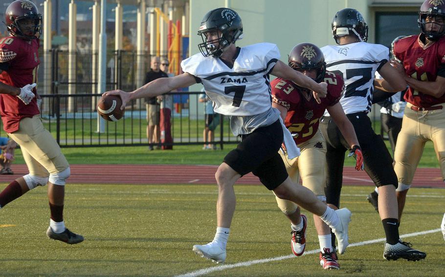 Zama quarterback Dominic Peruccio stretches for the end zone to cap a 2-yard touchdown run..