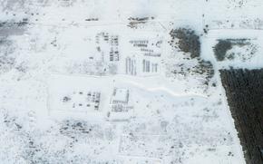 This satellite image provided by Planet Labs PBC shows vehicles and tanks stationed at the Pogonovo training area just south of the city of Voronezh, Russia, Wednesday, Jan. 26, 2022. Russia warned Wednesday it would quickly take "retaliatory measures" if the U.S. and its allies reject its security demands over NATO and Ukraine, raising pressure on the West amid concerns that Moscow is planning to invade its neighbor. (Planet Labs PBC via AP)