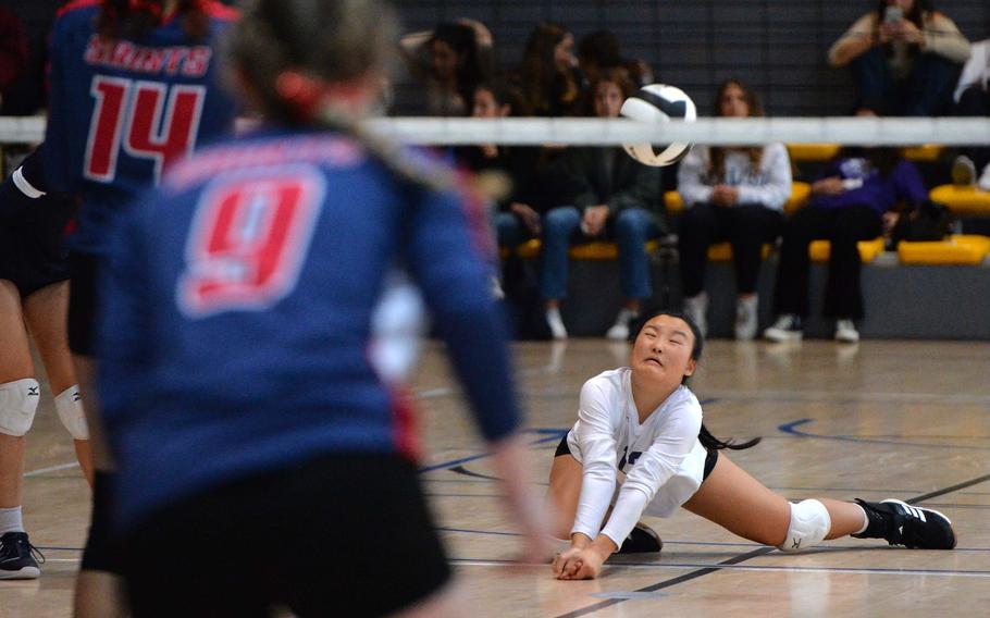Black Forest Academy’s Ester Lee digs deep to receive an Aviano serve in the Division II final at the DODEA-Europe volleyball championships. Aviano defeated the Falcons 25-19, 25-21, 24-26, 25-23. 