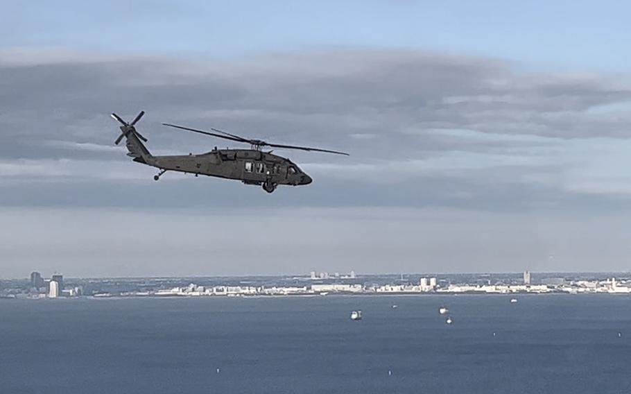 A U.S. Army UH-60L Black Hawk flies over Tokyo Bay, Tuesday, Jan. 17, 2023.