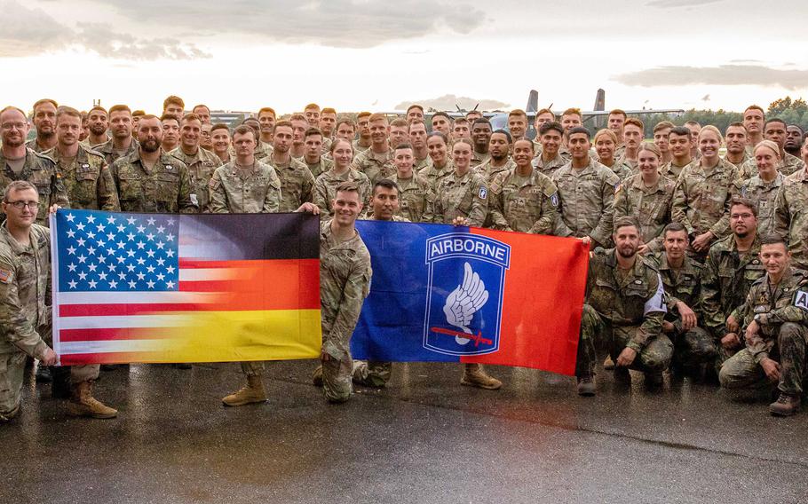 U.S. Army paratroopers from the 173rd Brigade Support Battalion, 173rd Airborne Brigade and German paratroopers with the 26th (Saarland) Airborne Brigade pose for a photo after jumping into Lake Constance, Germany, Friday, July 29, 2022.