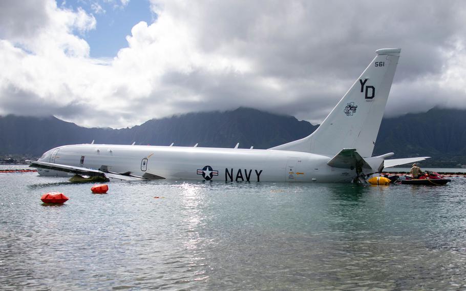 A U.S. Navy P-8A Poseidon rests in waters just off the runway at Marine Corps Air Station Kaneohe Bay. 
