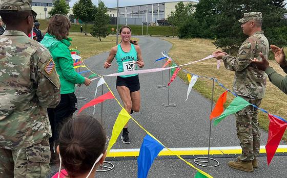 Sgt. Eva Perry, of the 207th Military Intelligence Brigade based in Vicenza, Italy, finishes first at the Installation Management Command Europe level, Army Ten-Miler qualifier event, June 25, 2022 at Grafenwoehr, Germany.