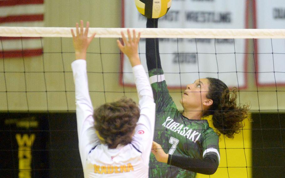 Kubasaki's Sophia Grubbs spikes against Kadena's Marina Sawyer during Thursday's Okinawa volleyball match. The Dragons won in straight sets, improving to 8-0 against the Panthers this season.