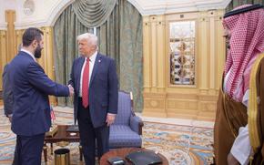In this photo released by the Saudi Royal Palace, Syria's interim President Ahmad al-Sharaa, left, shakes hands with President Donald Trump, centre, in Riyadh, Saudi Arabia, Wednesday, May 14, 2025. At right is Saudi Crown Prince Mohammed bin Salman.(Bandar Aljaloud/Saudi Royal Palace via AP)