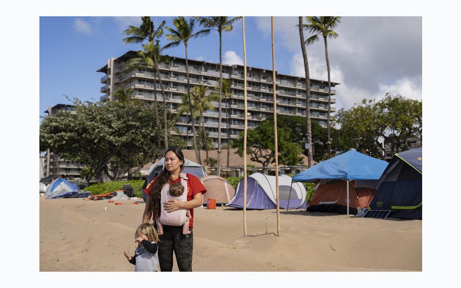 Jordan Ruidas, one of the organizers with Lahaina Strong, with her children, La'iku, left, and Waiaulia.