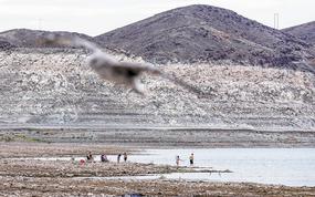 People enjoy Boulder Beach up the waterline where a body was found at Swim Beach within the Lake Mead National Recreation Area on July 26, 2022, near Boulder City. (L.E. Baskow/Las Vegas Review-Journal/TNS)